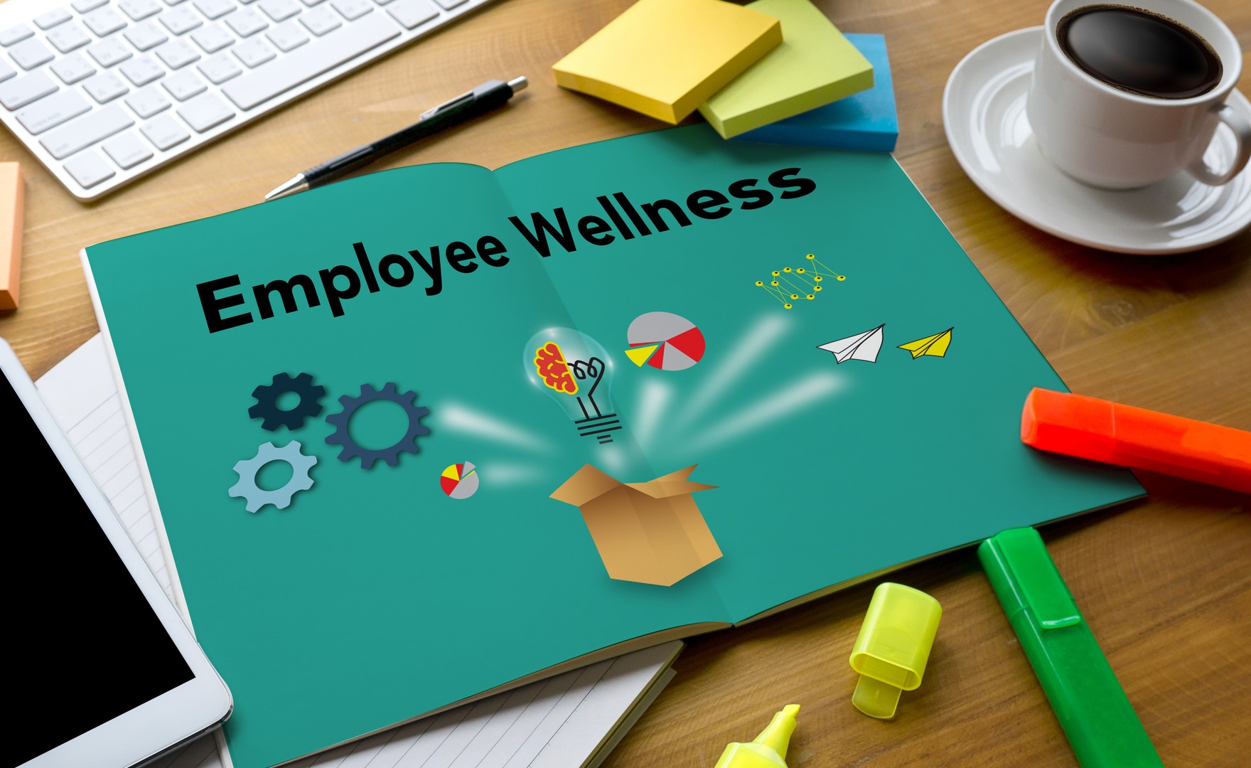Book on desk with pages open reading employee wellness